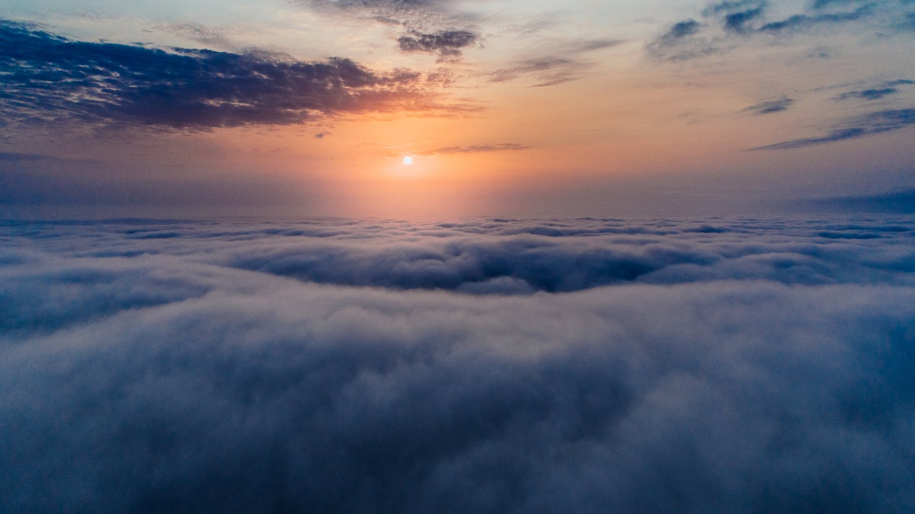 sea of clouds during sunset