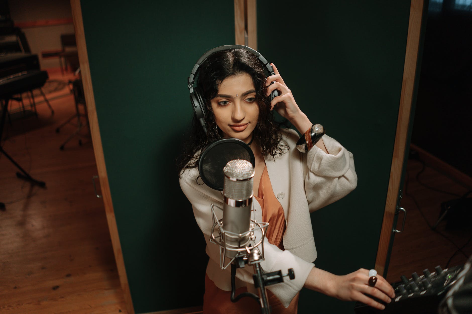 a female artist recording a song