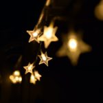 shallow focus photography of yellow star lanterns