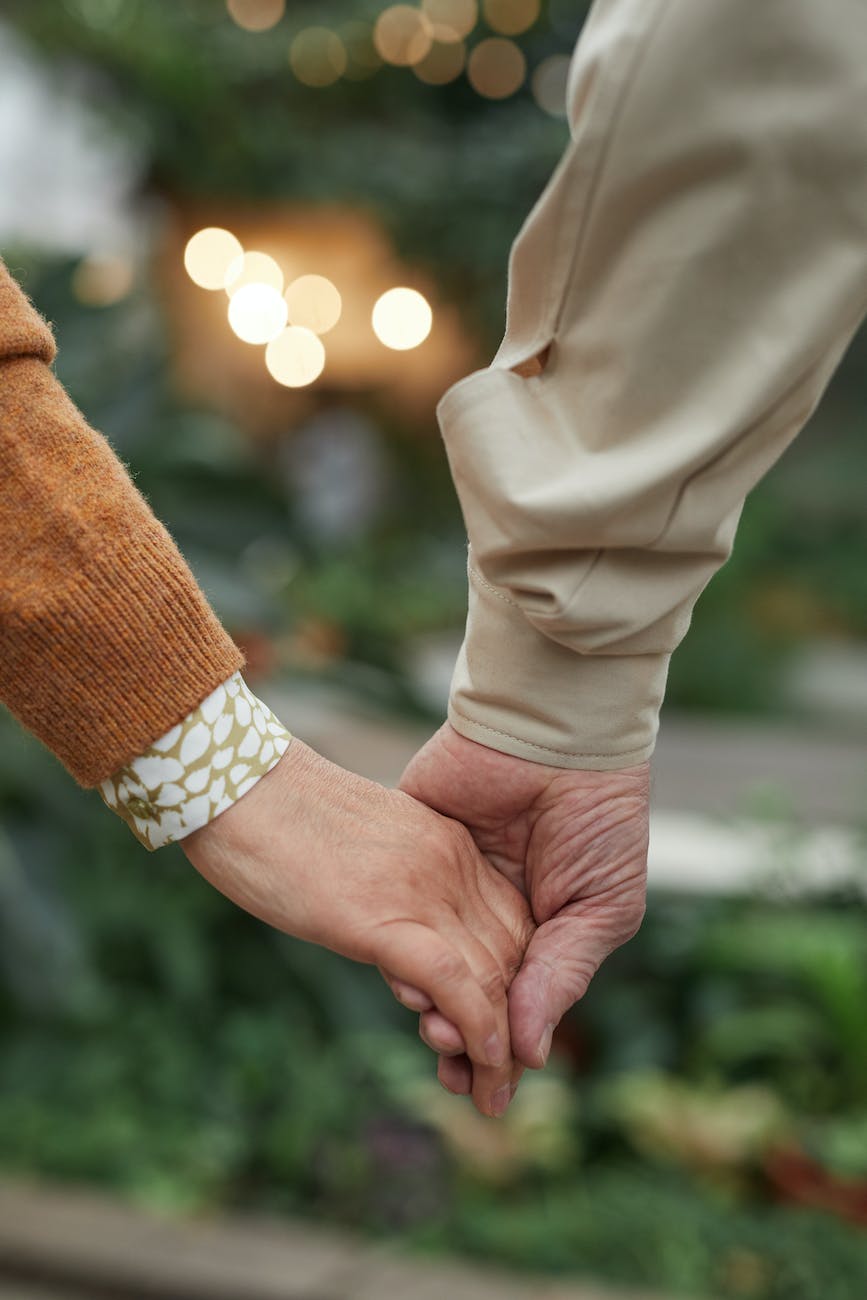 close up view of couple holding hands