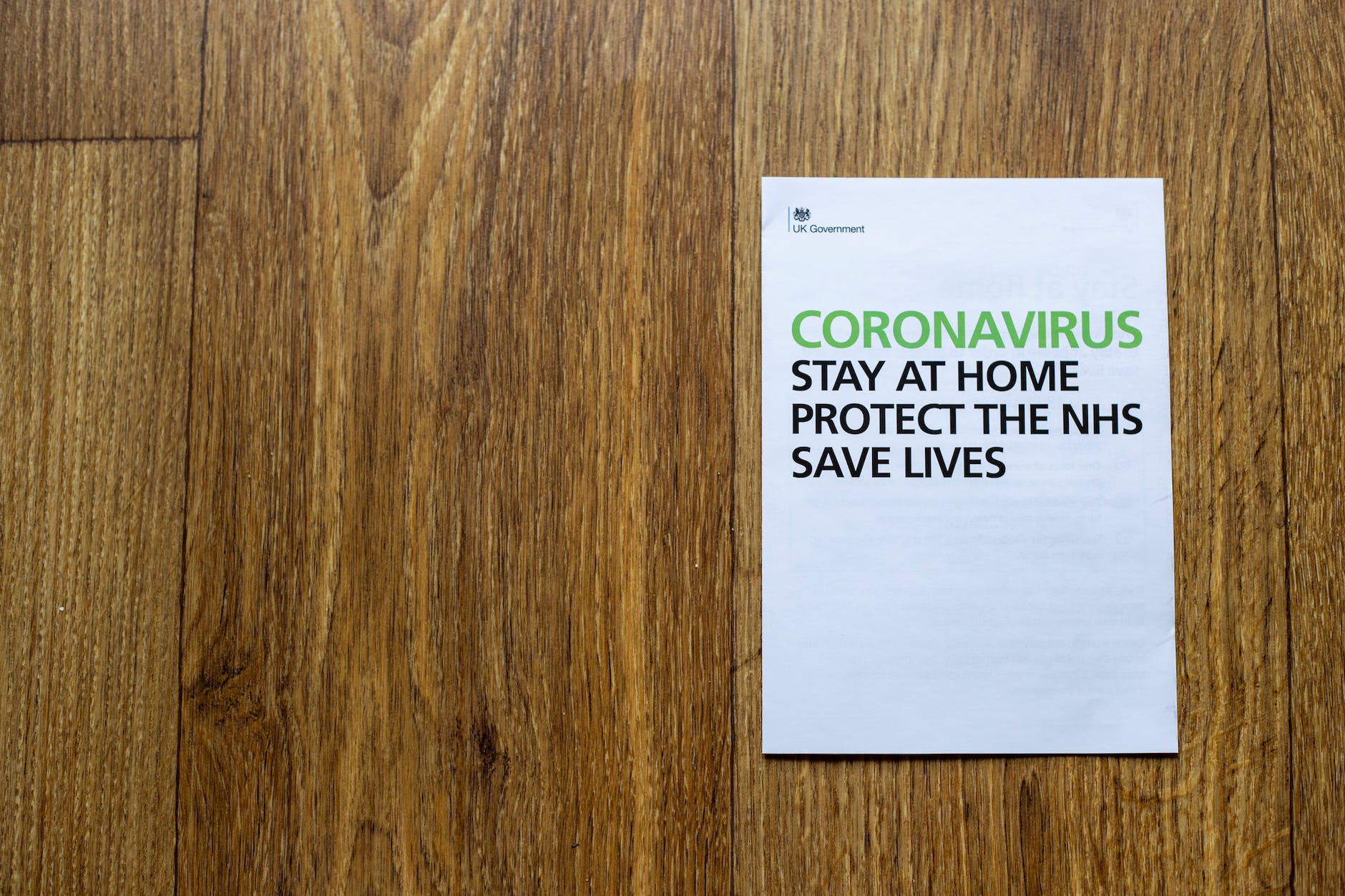 sheet of paper with inscription regarding coronavirus outbreak