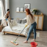 women cleaning a bedroom